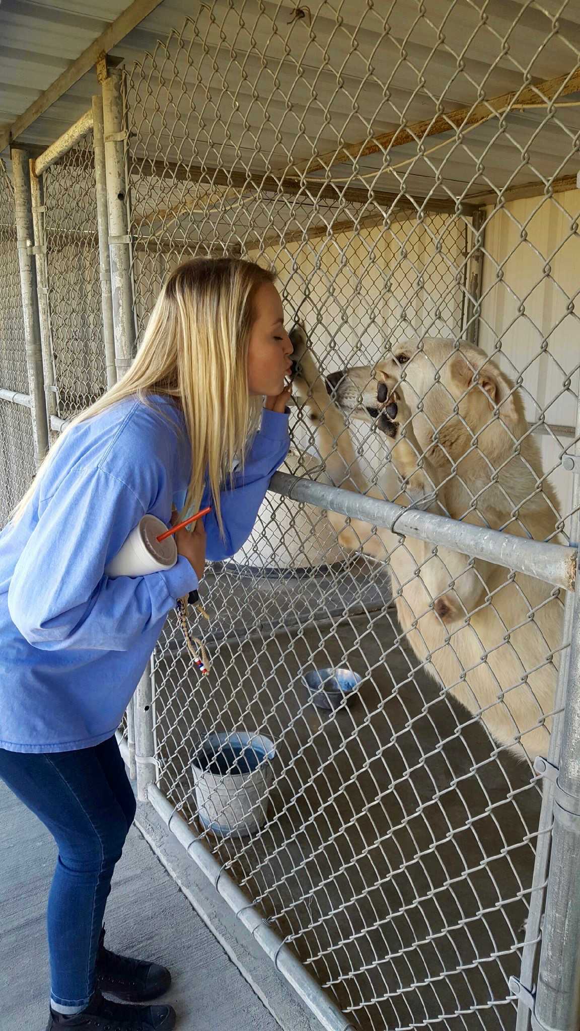 Malli Pingleton kisses on a sweet fur baby.