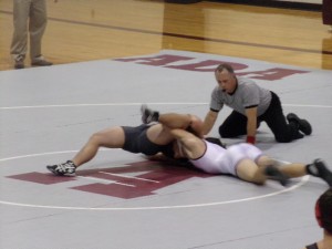 An AHS wrestler takes on his McCloud opponent. 