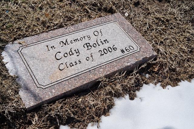 Memorial Stone of Cody Bolin, #60 in Football. Outside the front of the high school.