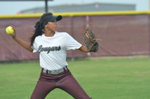 Number two, Krysten Wallace, makes a throw from right field.