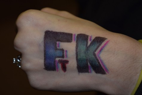 Tiyanna Melendez draws FTK on her hand, showing her support for the Children's Miracle Network. 