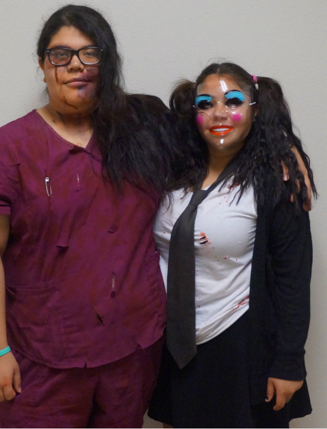 Jacky Lopez and Miranda Alonzo posing in their costumes