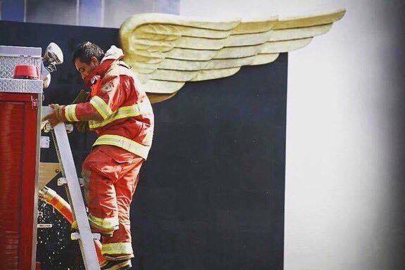 Mexican firefighter climbs the ladder during perfect alignment 