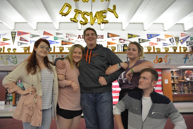 Getting into character, the lead actors pose for a pre-show picture. The cast members have developed a close relationship, claiming each other as family.