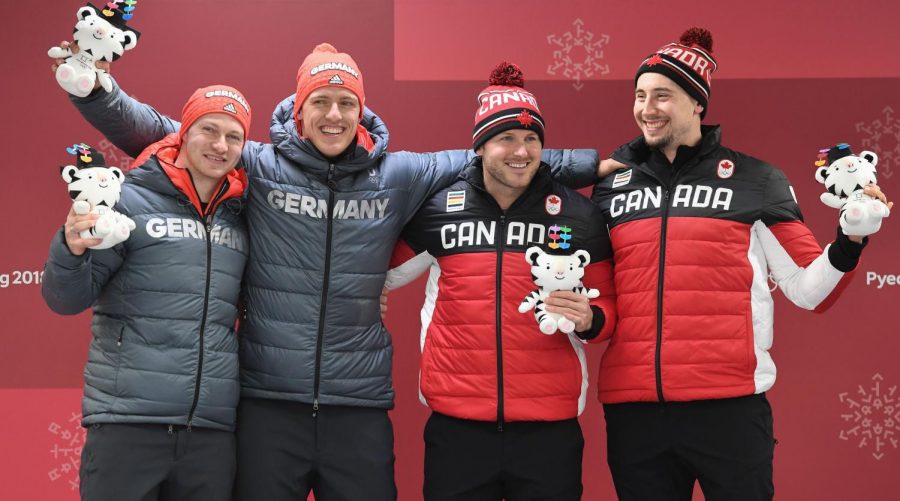 German and Canadian historically reach a tie in Bobsledding and are awarded First Place.