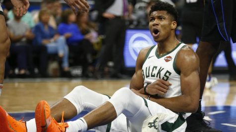 Giannis Antetokounmpo (34) celebrates after scoring a game winning dunk in the final seconds of regulation.