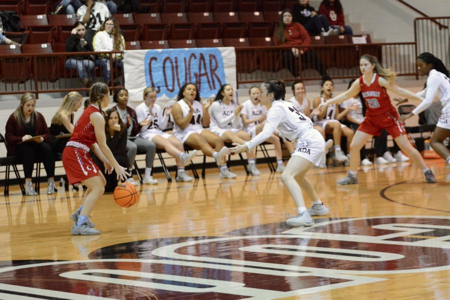 Guarding on her best defense during the semi finals of the ECOC, junior Landyn Owens tries to keep Collinsville from scoring. Owens also led offense with 16 points.