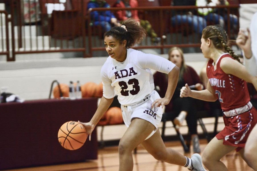 Dribbling down the court, sophomore Amaya Frizell went to score a layup. Frizell has been playing basketball for 10 years shows her heard work very well. 